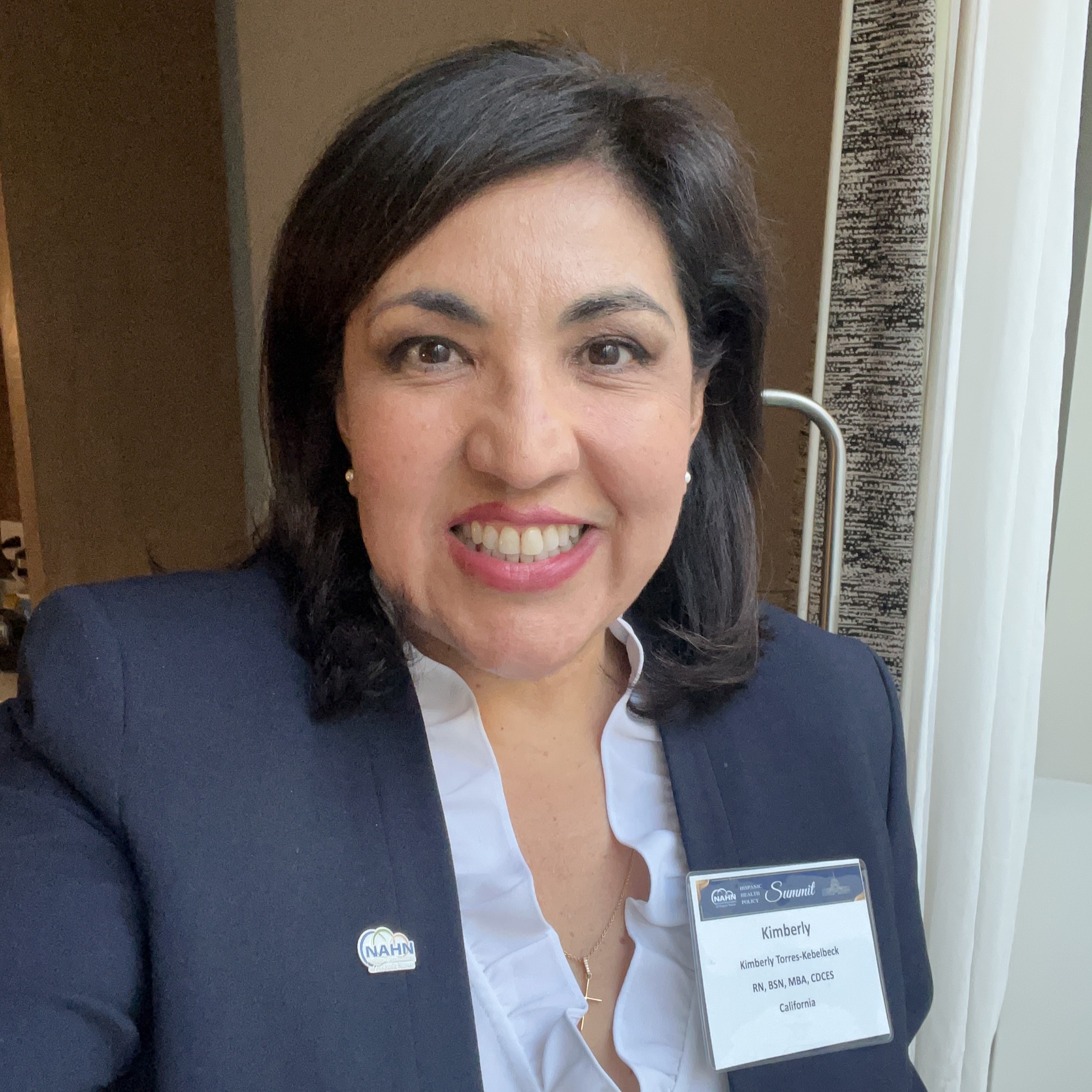 headshot of Kimberly Torres-Kebelbeck